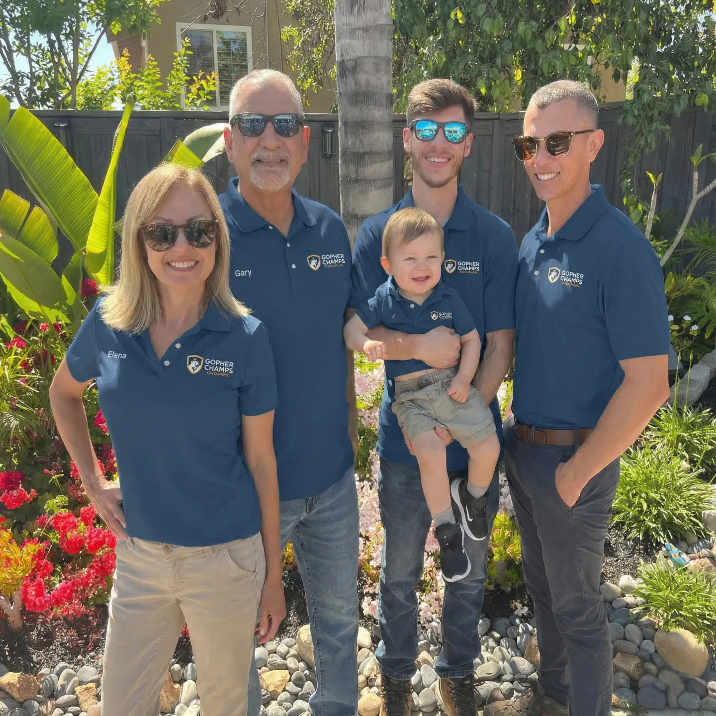 The Gopher Champs family team in branded green uniforms