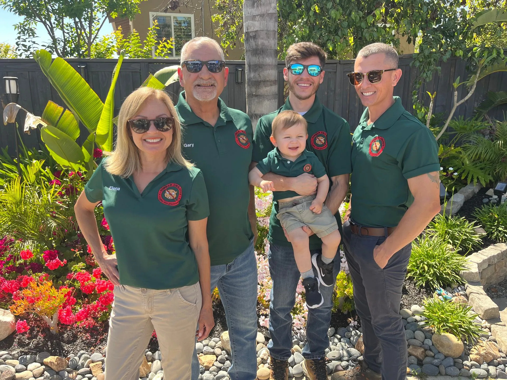 The Gopher Champs family team in branded green uniforms